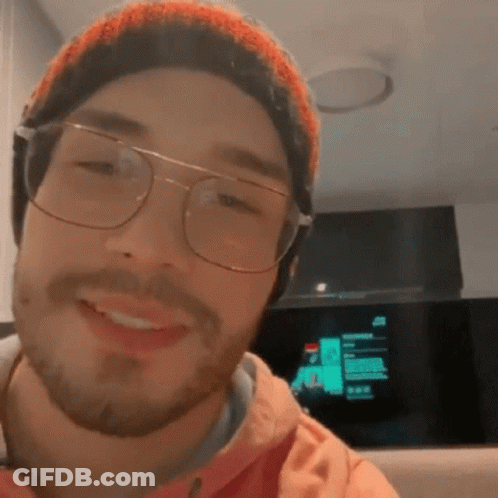 Bearded Man With Glasses And Beanie Smiling GIF