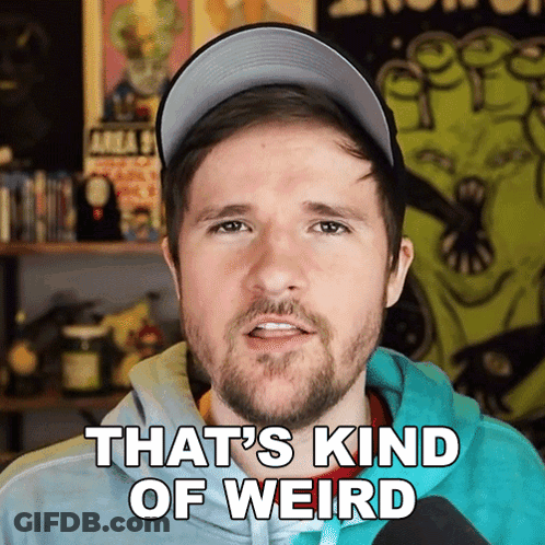 Bearded Man With Glasses And Blue Tie Making Funny Face GIF