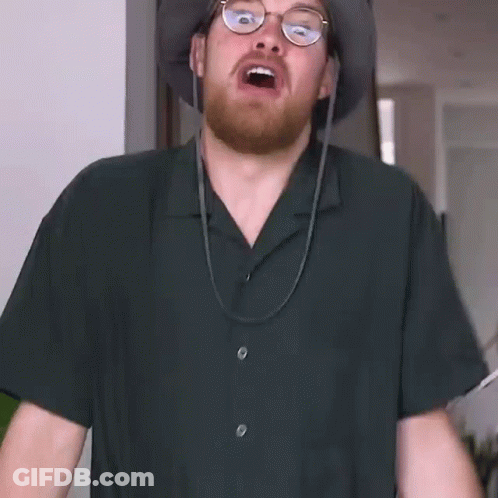 Bearded Man With Glasses And Hat Making Funny Face GIF