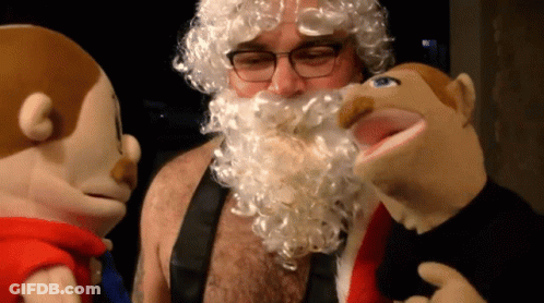 Bearded Man With Glasses And Stuffed Animals GIF
