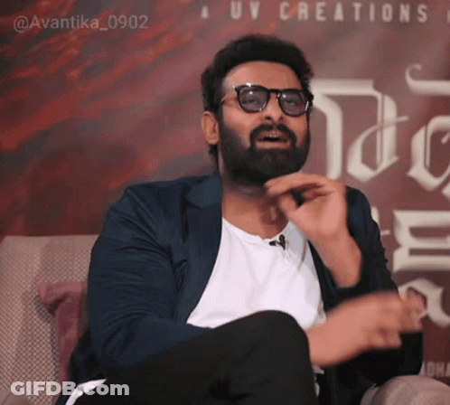 Bearded Man With Glasses And UV Creations Sign GIF
