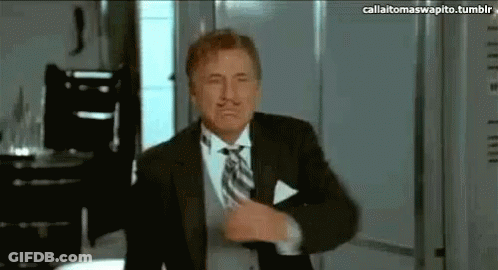 Bearded Man With Glasses By Luggage Shelf GIF