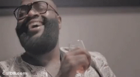 Bearded Man With Glasses Holding Whiskey GIF