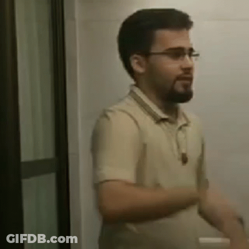 Bearded Man With Glasses In Bathroom GIF