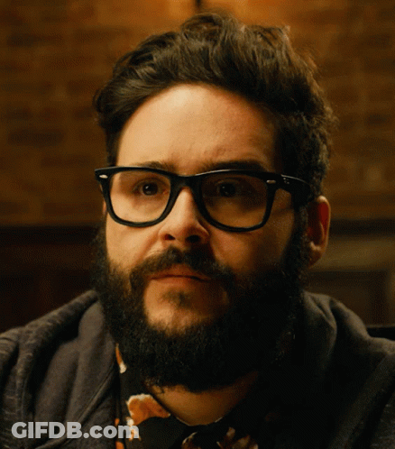 Bearded Man With Glasses Looking To Side GIF