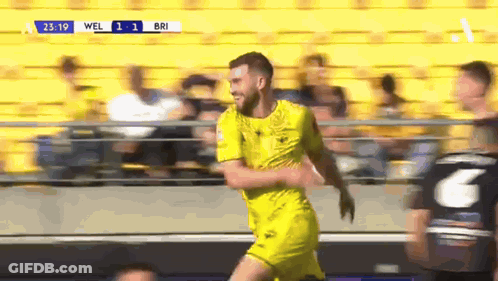 Bearded Man With Glasses Smiling In Crowd GIF