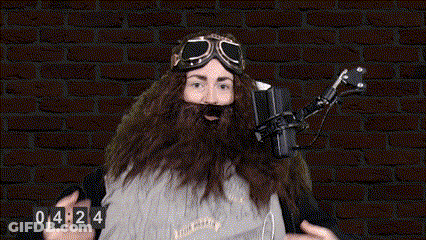 Bearded Man With Goggles At Microphone Clock 04:24 GIF