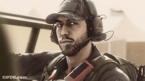 Bearded Man With Hat And Headphones Holding Red Device GIF