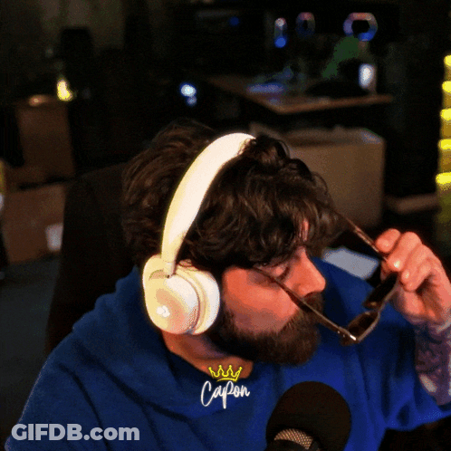 Bearded Man With Headphones And Cap On Shirt GIF