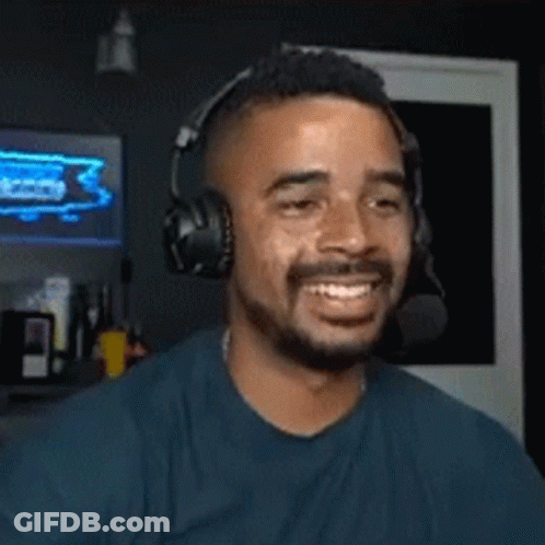 Bearded Man With Headphones And Microphone Smiling GIF