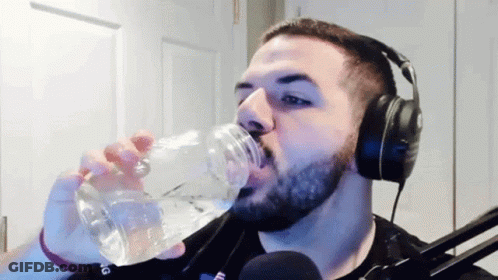 Bearded Man With Headphones Drinking Water GIF