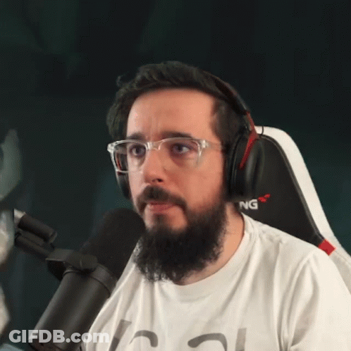 Bearded Man With Headphones Glasses In Gaming Chair GIF