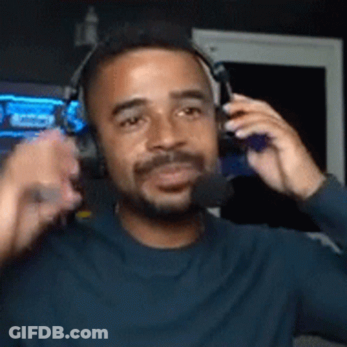 Bearded Man With Headphones Holding Microphone GIF