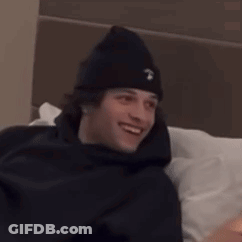 Bearded Man With Headphones Holding Stuffed Animal GIF