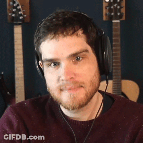 Bearded Man With Headphones Looking At Camera GIF