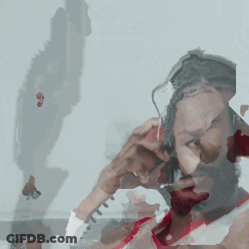 Bearded Man With Headphones Looking At Camera GIF