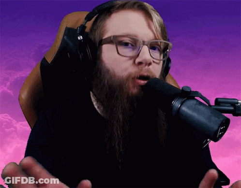 Bearded Man With Headphones Speaking Into Microphone GIF