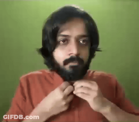 Bearded Man With Long Hair Adjusting Shirt GIF