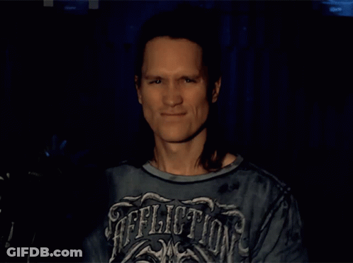 Bearded Man With Long Hair Says Rock And Roll GIF