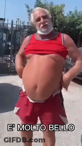 Bearded Man With Mask In Red Tank Top And Shorts GIF