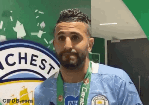Bearded Man With Medal And Chest Logo GIF