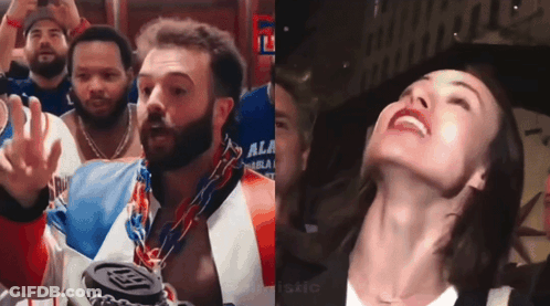 Bearded Man With Medal Next To Smiling Woman GIF