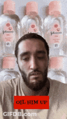 Bearded Man With Stack Of Johnson's Baby Oil GIF