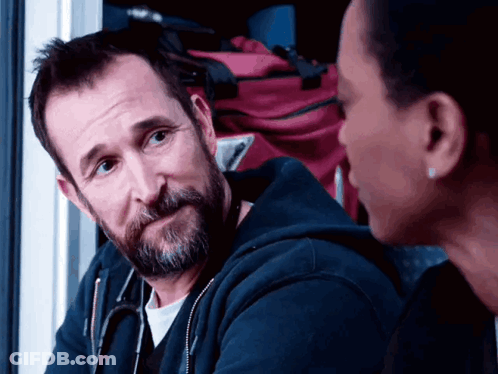 Bearded Man With Stethoscope Talking To Woman GIF