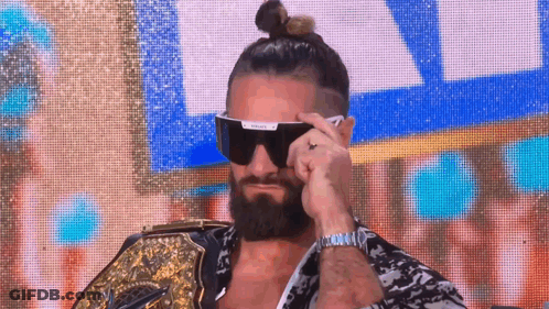 Bearded Man With Sunglasses Holding Wrestling Belt GIF