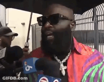 Bearded Man With Sunglasses Talking Into Microphone GIF
