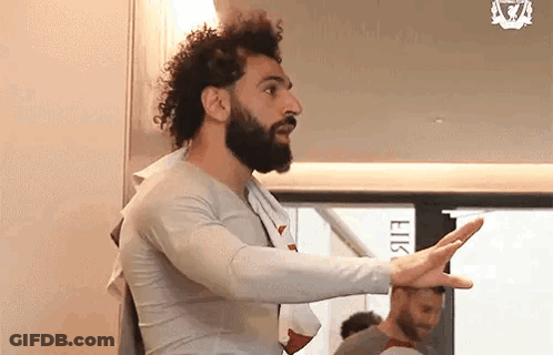 Bearded Man With Towel Around Neck And Arms Outstretched GIF