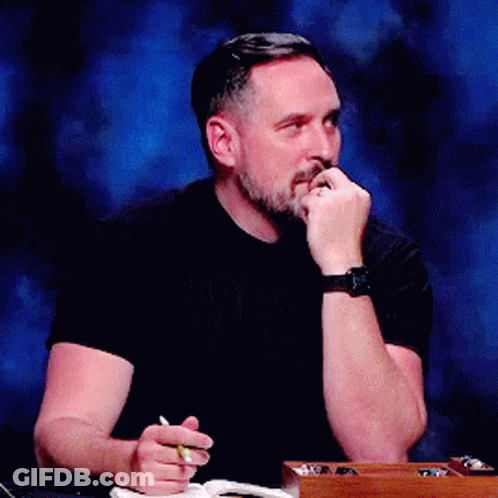 Bearded Man With Watch And Pen At Table GIF