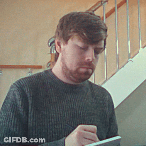 Bearded Man Writing On Notepad GIF