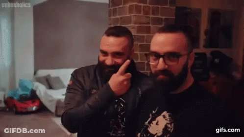 Bearded Men In Glasses Pointing At Face GIF