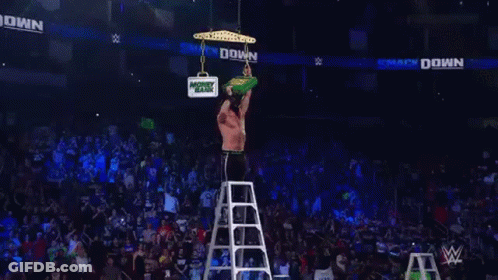 Bearded Wrestler Holding Green Money Bank GIF