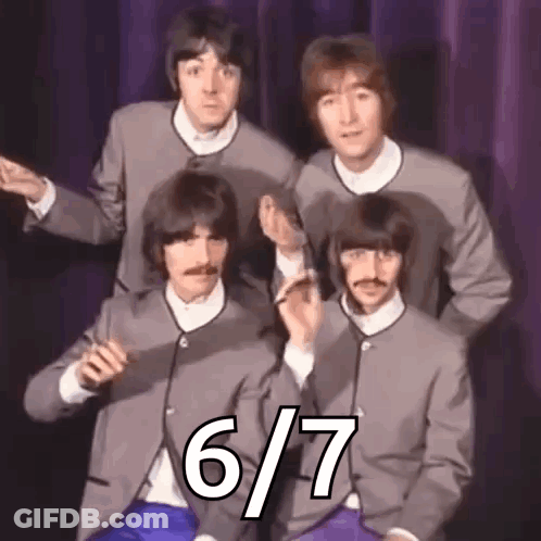 Beatles Posing In Suits Before Purple Curtain GIF