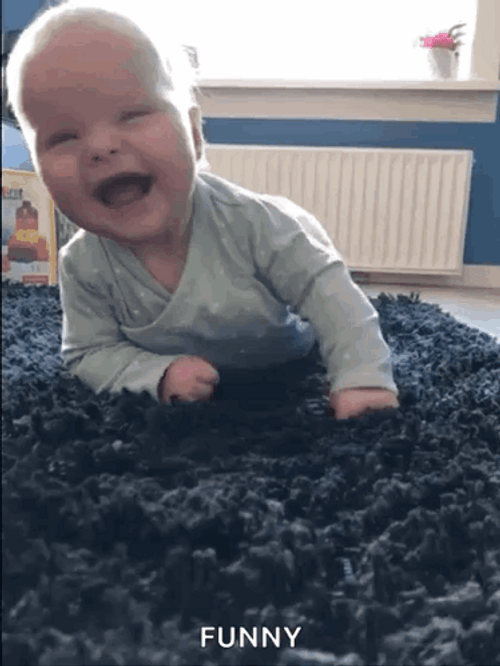 Beautiful Baby Rolling On The Floor Laughing GIF