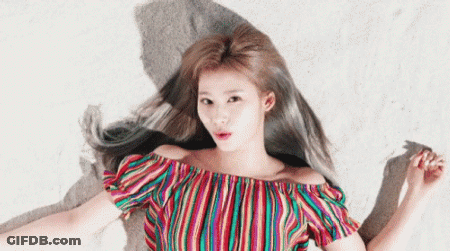 Beautiful Sana Laying Down On The Sand GIF