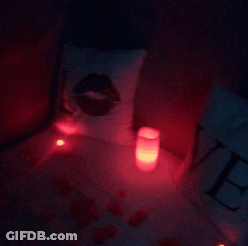 Bed With Pillow With Kiss And Candles GIF