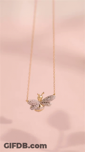 Bee Shaped Pendant Necklace Pink Background GIF