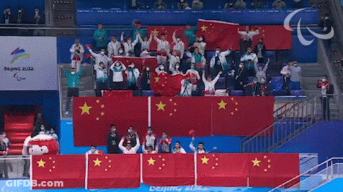 Beijing 2022 Sign Behind Crowd GIF