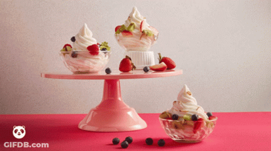 Berries And Cream In Moving Glass Bowls GIF