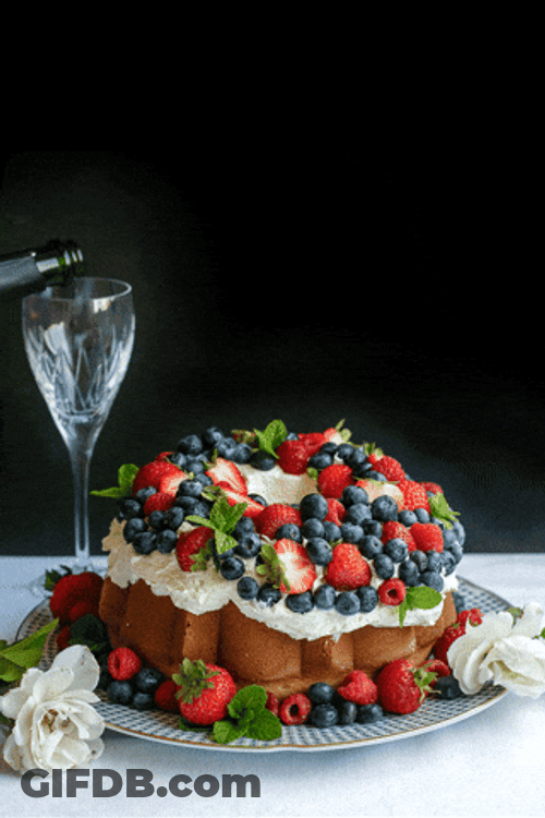 Berries And Cream On Top Of Cake GIF