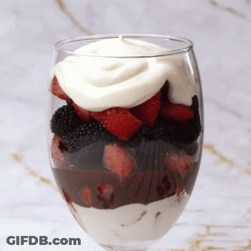 Berries And Cream With Chocolate Syrup In Glass GIF
