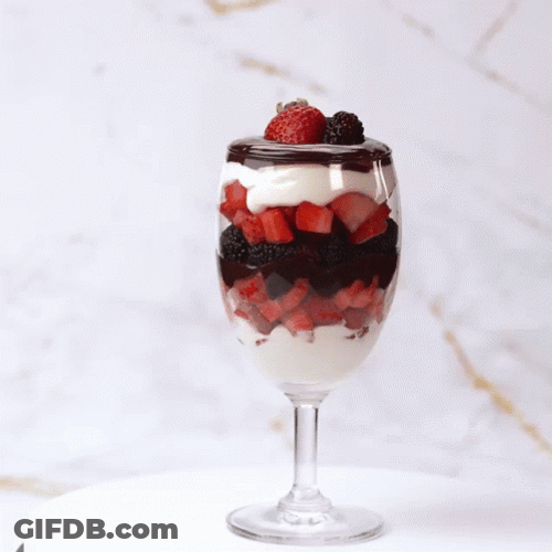 Berries And Cream With Chocolate Syrup Spinning Glass GIF