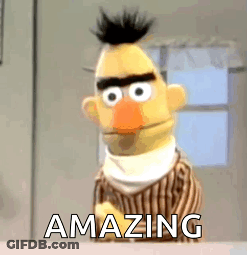 Bert From Sesame Street Is Standing In Front Of A Window With The Words Amazing Below Him GIF