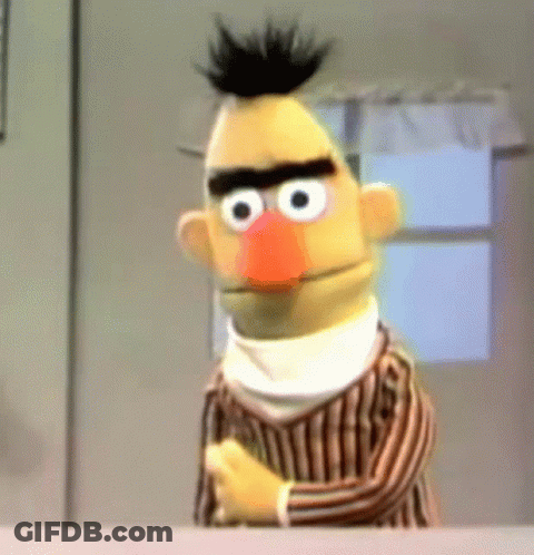 Bert From Sesame Street Is Wearing A Striped Shirt And A White Scarf Around His Neck GIF