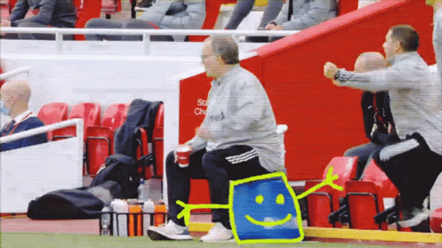 Bielsa Sitting Happily With Colleagues GIF