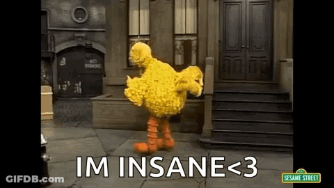 Big Bird From Sesame Street Is Dancing In Front Of A Building With The Words `` Im Insane < 3 '' . GIF