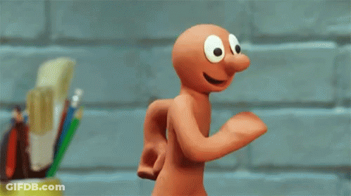 Big-Eyed Cartoon Character Running By Brick Wall GIF